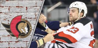 Ottawa Senators defenseman Kurtis MacDermid in a fight during an NHL game.