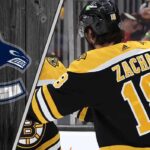 Boston Bruins center Pavel Zacha celebrates a goal during an NHL game, amid NHL trade rumors involving the Vancouver Canucks.