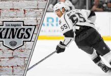 Quinton Byfield in a Los Angeles Kings jersey skating with a hockey stick, celebrating a goal, illustrating his 2025-26 point projections.