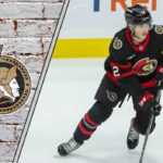 Shane Pinto’s Contract Standoff: A High-Stakes Gamble for the Ottawa Senators Ottawa Senators forward Shane Pinto skating with the puck during an NHL game, illustrating his strong negotiating position in his contract talks.