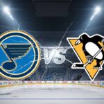 A wide-angle, stylized image featuring the St. Louis Blues logo on the left and the Pittsburgh Penguins logo on the right, with a "VS" graphic in between them, all set against a spotlight-illuminated interior of an empty hockey arena with a large jumbotron above center ice.