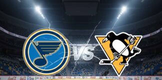 A wide-angle, stylized image featuring the St. Louis Blues logo on the left and the Pittsburgh Penguins logo on the right, with a "VS" graphic in between them, all set against a spotlight-illuminated interior of an empty hockey arena with a large jumbotron above center ice.
