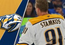 A focused Steven Stamkos skating in his Nashville Predators uniform during a game.