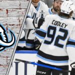 Utah Mammoth star Logan Cooley celebrates a goal, focused on the play after signing his $80 million contract extension