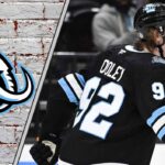 Logan Cooley’s Calculated Risk: Why He Rejected the Utah Mammoth’s Massive Offer Utah Mammoth forward Logan Cooley skates with the puck, looking determined, during a game, illustrating his focus on a larger contract.