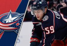 Columbus Blue Jackets forward Yegor Chinakhov skates during an NHL game, looking for a pass amidst NHL trade rumors.