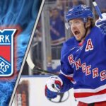 New York Rangers forward Artemi Panarin skating with the puck during an NHL game, amid KHL trade rumors.