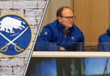 Sabres Staring Down a Roster Crisis: Analyzing Kevyn Adams’ Next Move After Kulich Injury Buffalo Sabres GM Kevyn Adams looks on from the press box, contemplating his next move as trade rumors swirl around the team.