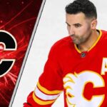 Flames center Nazem Kadri skates with the puck, looking to make a play in the offensive zone.