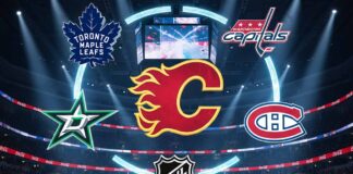 Kadri on the Block: Analyzing 4 Perfect Fits and 1 Surprise “Best” Spot A stylized digital graphic inside a packed NHL arena, featuring the Calgary Flames logo at the center, encircled by the logos of the Toronto Maple Leafs, Washington Capitals, Dallas Stars, and Montreal Canadiens. Spotlights shine down on the arrangement from the arena's rafters.