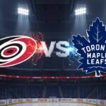 Can the Leafs Stop the Storm? Hurricanes vs. Maple Leafs TV, Prediction, and Odds A stylized image showing the Carolina Hurricanes logo and the Toronto Maple Leafs logo colliding, with "Vs" between them. The background is an illuminated hockey arena interior with Coca-Cola logos on the boards.