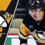 Is This Goodbye? Why Evgeni Malkin’s Hot Streak Could Mean a Heartbreaking Penguins Trade Pittsburgh Penguins center Evgeni Malkin skates with the puck, looking to make a play during a 2025 NHL game, illustrating his trade deadline value.