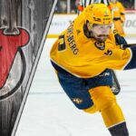 Is a Filip Forsberg Trade the Missing Piece for the New Jersey Devils? Filip Forsberg taking a shot on goal with the New Jersey Devils logo to the left signifying a NHL trade rumor