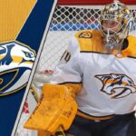 Nashville Predators goalie Juuse Saros looks on intently during a game, his future with the struggling team in question amid NHL trade rumors.