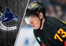 Lukas Reichel skating for the Vancouver Canucks during an NHL game amidst NHL trade rumors