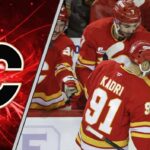 Nazem Kadri of the Calgary Flames celebrates a goal during an NHL game, representing the team's refusal to tank or trade veteran leadership.