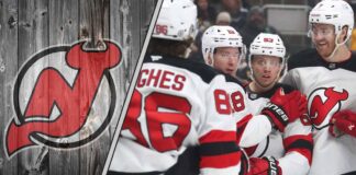 New Jersey Devils players celebrating a win but will the team make a trade for a defenseman?
