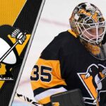 Pittsburgh Penguins Rumors: Goalie Surplus Sparks Trade Talk? Pittsburgh Penguins goaltender Tristan Jarry making a save during a game, sparking NHL trade rumors regarding the team's goaltending depth.