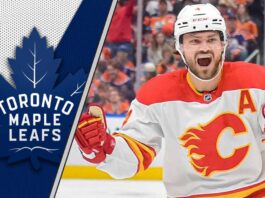 Rasmus Andersson to the Maple Leafs? Why This Flames Trade Rumor is More Dangerous Than You Think Calgary Flames defenseman Rasmus Andersson skates during an NHL game, amidst NHL trade rumors involving the Toronto Maple Leafs.