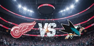 A stylized image depicting the Detroit Red Wings logo and the San Jose Sharks logo colliding above center ice in a packed hockey arena. The word 'VS' shatters between them, illuminated by spotlights in the background, which is the San Jose Sharks' home arena.