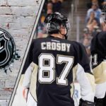 Sidney Crosby and Evgeni Malkin skates up the ice for the Pittsburgh Penguins, looking focused during a 2025-26 NHL game.