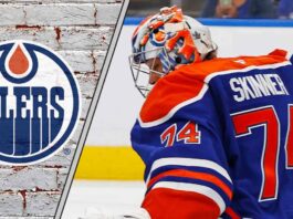 Edmonton Oilers goaltender Stuart Skinner looking focused in his crease during an NHL game at Rogers Place.