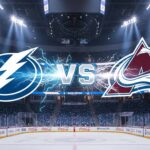 A stylized game matchup graphic showing the Tampa Bay Lightning logo and the Colorado Avalanche logo colliding at ice level with electrical energy. The silver text 'VS' is between them, set against the background of Ball Arena under spotlights, with Coca-Cola logos visible on the rink boards.
