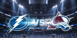 A stylized game matchup graphic showing the Tampa Bay Lightning logo and the Colorado Avalanche logo colliding at ice level with electrical energy. The silver text 'VS' is between them, set against the background of Ball Arena under spotlights, with Coca-Cola logos visible on the rink boards.