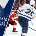 Brandon Carlo of the Toronto Maple Leafs skating with the puck during an NHL game at Scotiabank Arena.