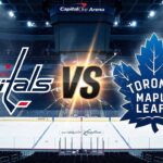 Stylized graphic showing the Washington Capitals logo on the left facing off against the Toronto Maple Leafs logo on the right, separated by a large "VS". They are illuminated by spotlights on the ice surface of a dimly lit hockey arena.