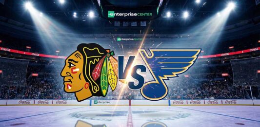 Rivalry Night: How to Watch Blackhawks vs. Blues on Friday, Dec. 12 Chicago Blackhawks and St. Louis Blues logos colliding on a hockey rink inside the Enterprise Center, with a large 'VS' between them and spotlights shining on the ice.