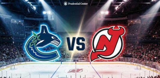 A wide-angle view inside the Prudential Center arena, featuring the Vancouver Canucks and New Jersey Devils logos floating above the center-ice circle, separated by a large "VS" graphic. Spotlights illuminate the logos and the ice surface, which also shows the Devils' center-ice logo.