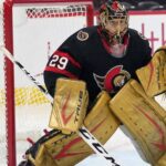 A composite photograph showing goaltender Marc-Andre Fleury in his signature gold pads and gloves, wearing the black home jersey of the Ottawa Senators while in a butterfly stance in front of a net.