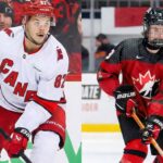 A vertical split-screen photograph showing two hockey players in action. On the left, Jesperi Kotkaniemi of the Carolina Hurricanes skates with the puck in a white away jersey. On the right, Team Canada prospect Gavin McKenna skates with the puck wearing a red jersey and a full face shield.