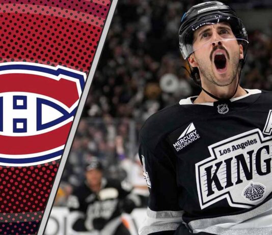 Los Angeles Kings center Phillip Danault skating during a game, subject of recent NHL trade rumors regarding a potential move to Montreal or New Jersey.