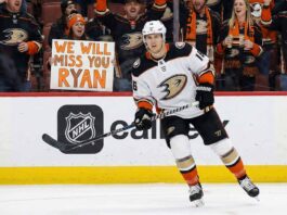 Report: Anaheim Ducks Open to Trading Ryan Strome Amid Roster Crunch Anaheim Ducks player number 16, Ryan Strome, skates on the ice, looking towards fans behind the glass. A fan in the front row holds up a handwritten sign that says "WE WILL MISS YOU RYAN".