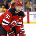 Steven Stamkos Linked to New Jersey Devils: Analyzing the Blockbuster Rumor Nashville Predators captain Steven Stamkos skating during a game, subject of New Jersey Devils trade rumors.