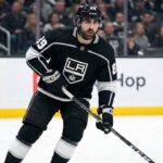 Los Angeles Kings forward Alex Tuch (89) skating on the ice in a black home jersey during an NHL game.