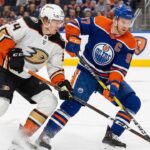Ducks vs. Oilers Tonight: TV Channel, Time, & Can Anaheim’s Streak Continue? Anaheim Ducks forward Cutter Gauthier (left), wearing a white number 34 away jersey, battles for control of the puck against Edmonton Oilers captain Connor McDavid (right), wearing a blue number 97 home jersey, during an NHL game on the ice at Rogers Place in Edmonton.