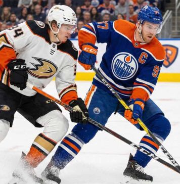 Ducks vs. Oilers Tonight: TV Channel, Time, & Can Anaheim’s Streak Continue? Anaheim Ducks forward Cutter Gauthier (left), wearing a white number 34 away jersey, battles for control of the puck against Edmonton Oilers captain Connor McDavid (right), wearing a blue number 97 home jersey, during an NHL game on the ice at Rogers Place in Edmonton.