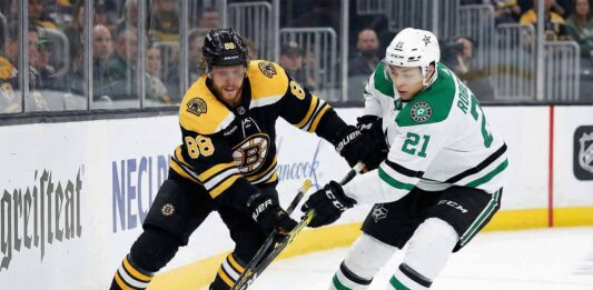 Bruins vs. Stars Preview: Can Boston’s Win Streak Survive Dallas? (TV & Odds) David Pastrnak of the Boston Bruins and Jason Robertson of the Dallas Stars battle for the puck along the boards during an NHL game.