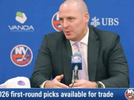 Going All-In: Why the New York Islanders Are Open to Trading a 2026 First-Round Pick New York Islanders GM Mathieu Darche speaking at a press conference with a news graphic banner overlay at the bottom reading "2026 first-round picks available for trade."