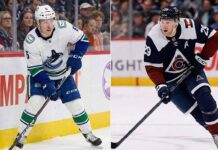 NHL News: A Historic Night for Legends & A Total Collapse in Vancouver Split image showing Vancouver Canucks forward Brock Boeser (left) in a white away jersey and Colorado Avalanche forward Nathan MacKinnon (right) in a navy home jersey, both skating with the puck during NHL game action.