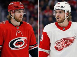 Analyzing the Robert Thomas Trade Block Rumors: Blues, Hurricanes, and Red Wings Scenarios A split-frame photograph showing NHL forward Robert Thomas. On the left, he wears a red Carolina Hurricanes home jersey and a red helmet. On the right, he wears a white Detroit Red Wings away jersey and a white helmet.