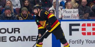 Vancouver Canucks defenseman Filip Hronek skating during an NHL game. Hronek is currently the subject of intense trade rumors which his agent, Allan Walsh, has publicly denied.