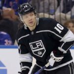 Los Angeles Kings forward Artemi Panarin, wearing a black jersey with the number 10, looks to his left while on the ice during a game.