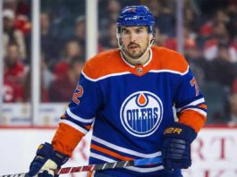 The Hidden Cost: How the Edmonton Oilers Can Steal Justin Faulk from the St. Louis Blues A photo of St. Louis Blues defenseman Justin Faulk in an Edmonton Oilers home jersey.