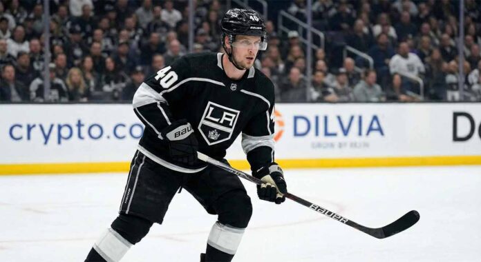 Elias Pettersson, wearing a black Los Angeles Kings #40 jersey and helmet, stands on the ice holding his hockey stick during a game.