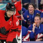 A split-screen photograph depicting contrasting moments in Olympic hockey. On the left side, Team Canada men's captain Sidney Crosby, wearing his red number 87 jersey, looks downward while on the ice. On the right side, several members of the Team USA women's hockey team, wearing blue jerseys, smile excitedly while holding and biting their gold medals behind a podium featuring the Olympic rings.