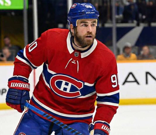 Why the Montreal Canadiens’ Secret Push for Ryan O’Reilly Makes Perfect Sense A concept visualization showing current Nashville Predators center Ryan O'Reilly wearing a Montreal Canadiens red home uniform and blue helmet on the ice, illustrating recent NHL trade rumors linking the veteran forward to the Habs.